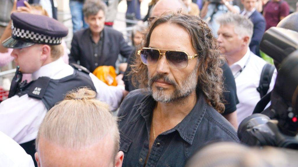 Comedian and actor Russell Brand bailed after appearing in court charged with rape and sexual assault