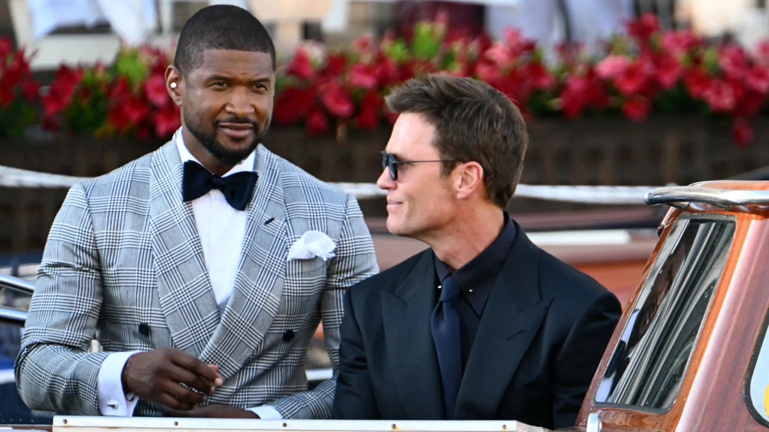 US singer-songwriter Usher with American football star Tom Brady at Jeff Bezos and Lauren Sanchez's wedding in Venice