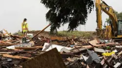 Trump visits Texas flood sites amid search for missing