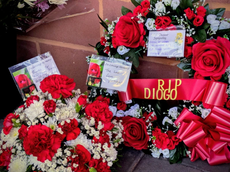 Fans gather outside Anfield to leave wreaths and flowers at the Hillsborough memorial.