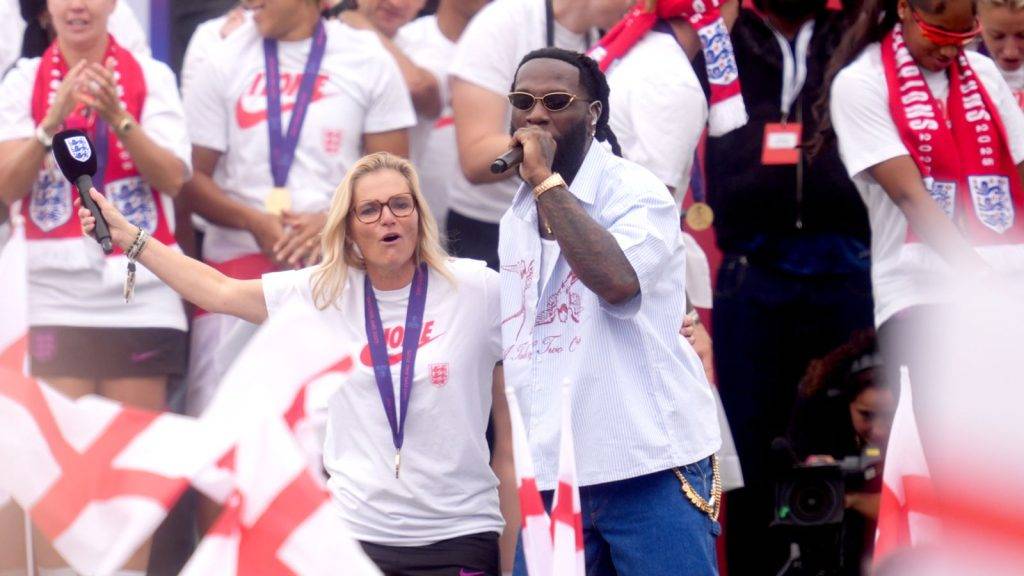 England manager Wiegman dances and sings on stage with Burna Boy at victory celebration