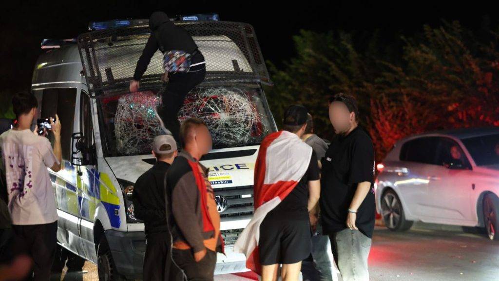 Protesters clash with police outside Essex hotel believed to house asylum seekers