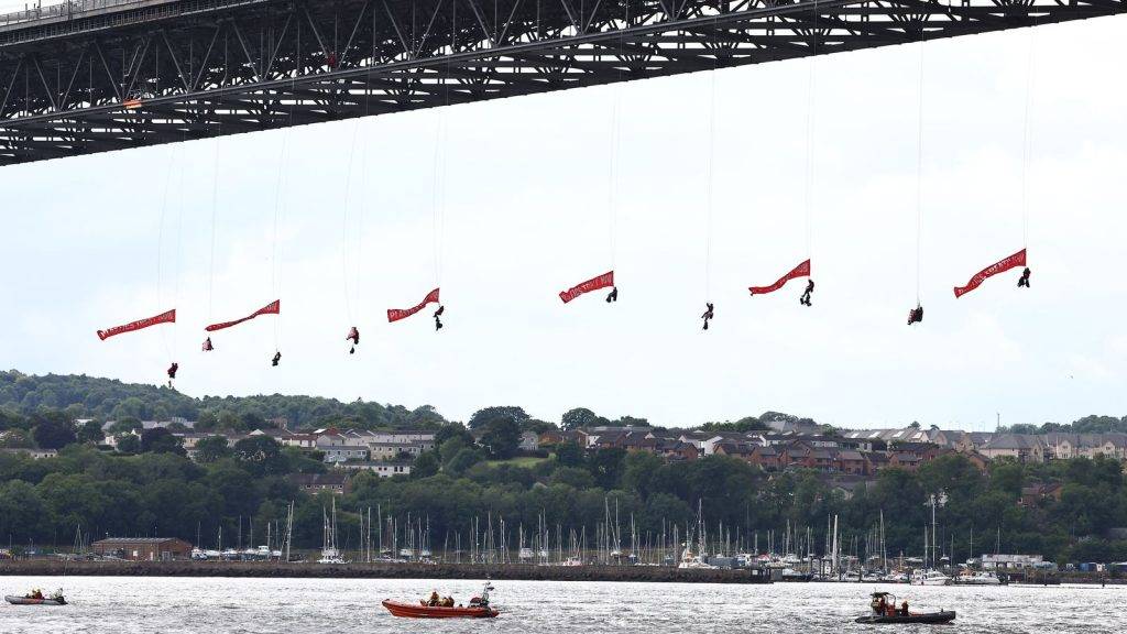 Ten Greenpeace activists arrested after suspending themselves from bridge outside Edinburgh
