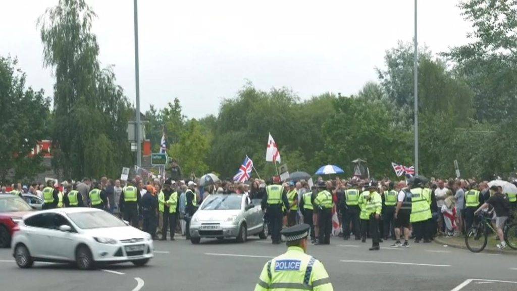 There seems no end in sight to asylum hotel protests as five intense minutes by a roundabout in Norwich proved