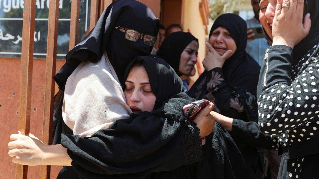 At least 59 killed in Gaza after Israeli military opens fire near aid centre and carries out strikes