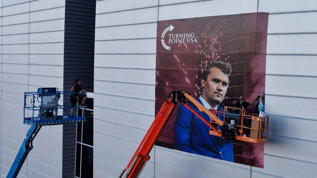 Armed man charged with impersonating police officer at Charlie Kirk memorial stadium