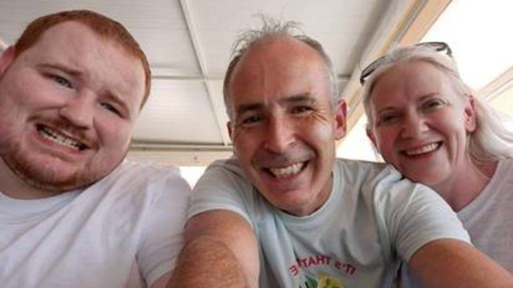 Man charged with murder of his parents and brother after their bodies found at family home