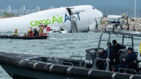 Two die as cargo plane skids off Hong Kong runway into sea