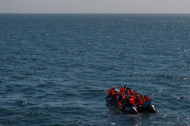 AT SEA, ENGLAND - APRIL 27: An inflatable 'small boat' carrying migrants crosses the channel after leaving northern France on April 27, 2026 in Dover, England. Last week the UK and France signed a £662 million, three-year deal to curb small boat crossings, featuring a first-of-its-kind £160 million "results-based" payment conditional on a reduction in arrivals. The agreement funds a 42% increase in French coastal personnel, a new removal centre in Dunkirk, and advanced surveillance technology. While designed to disrupt smuggling gangs and secure beaches with riot-trained officers, early reports show smugglers have already begun shifting launch sites further south to bypass the intensified patrols. (Photo by Dan Kitwood/Getty Images)