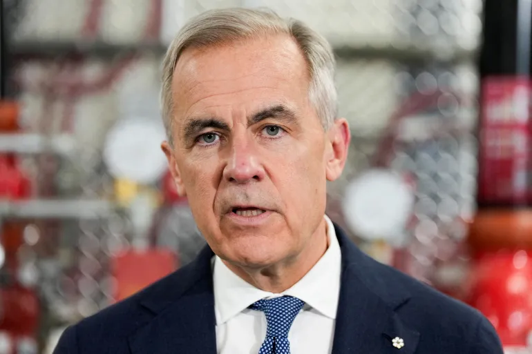 FILE PHOTO: Canada's Prime Minister Mark Carney speaks as he meets unionized skilled trades workers at the United Association of Journeymen and Apprentices of the Plumbing and Pipefitting Industry of the <a href=