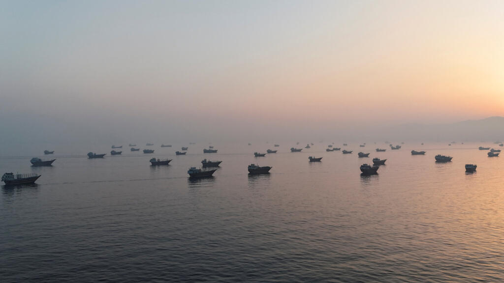 A drone view shows vessels in the Strait of Hormuz as seen from Musandam, Oman