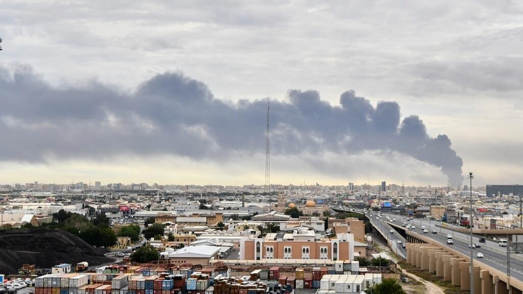 Smoke rises from Kuwait international airport after a drone strike on fuel storage in Kuwait City.