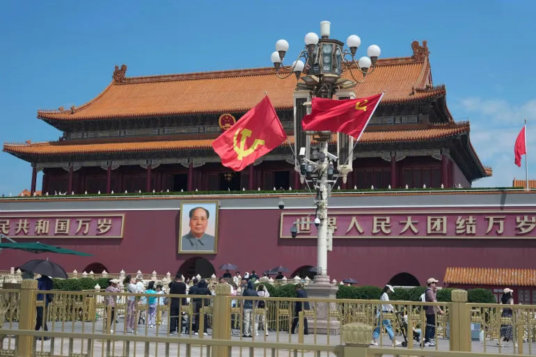 Flags bearing the hammer and sickle are flown in front of Tiananmen Gate in Beijing, China, on June 4, 2026