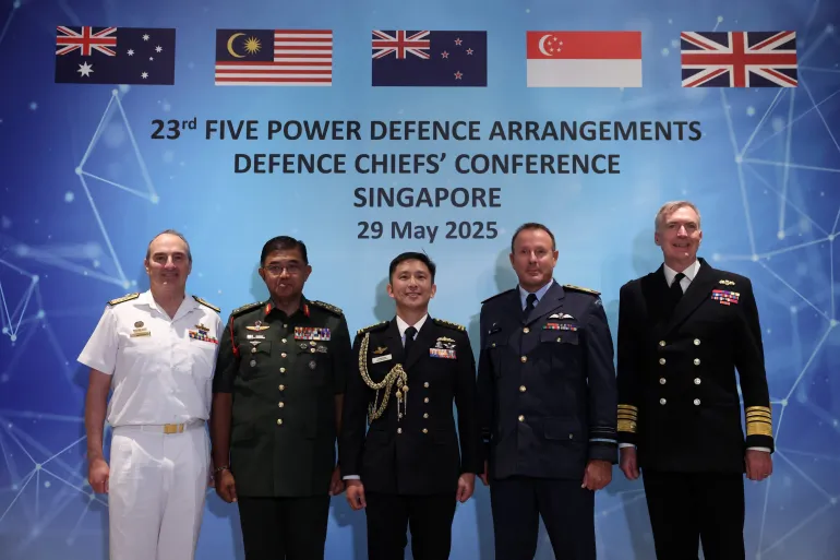 Singapore’s Chief of Defence Force Vice Admiral Aaron Beng, Australia’s Chief of Defence Force Admiral David Johnston, Malaysia’s Chief of Defence Force General Mohd Nizam Jaffar, New Zealand’s Chief of Defence Force Air Marshall Tony Davies, and UK Chief of the Defence Staff Admiral Tony Radakin pose at the Five Power Defence Arrangements (FPDA) Defence Chiefs’ Conference in Singapore, on May 29, 2025
