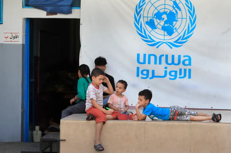 FILE - Palestinian children who fled with their parents from their houses in the Palestinian refugee camp of Ein el-Hilweh, gather in the backyard of an UNRWA school, in Sidon, Lebanon, Sept. 12, 2023. (AP Photo/Mohammed Zaatari, File)