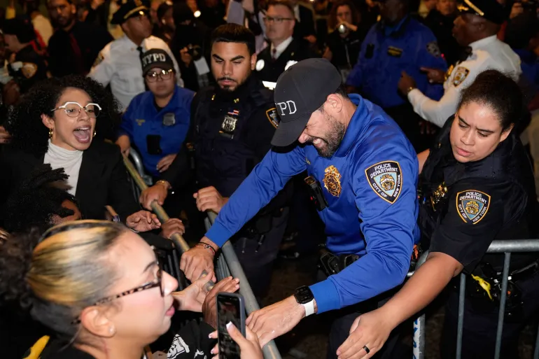 Protesters scuffle with police near the scene of the shooting of a man by an Immigration and Customs Enforcement (ICE) agent in New York on October 8, 2026