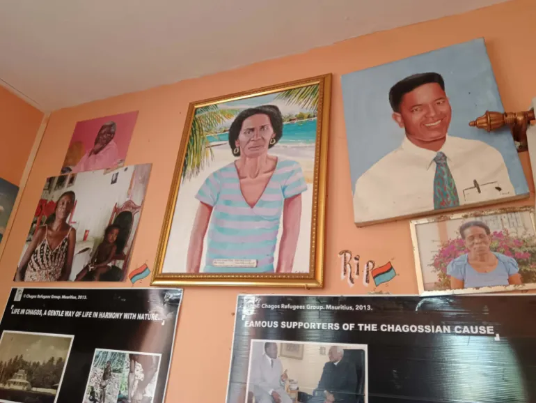 Portraits of native Chagossians who have passed away hang on the walls of the Chagos Refugees Group headquarters.