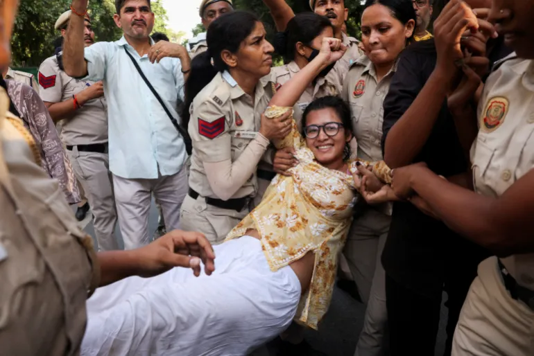 Neha Bora, National President of the All India Students' Association (AISA), reacts as she is detained by police during a protest against alleged assault on female protestors and journalists by Delhi Police and demanding resignation of chief election commissioner Gyanesh Kumar in New Delhi, India, October 4, 2026. REUTERS/Bhawika Chhabra